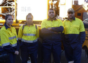 group of adult employment participants in high vis